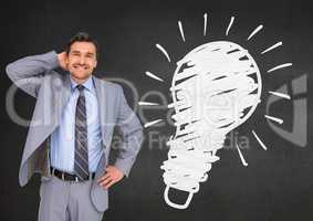 Digital composite image of businessman standing next to light blub