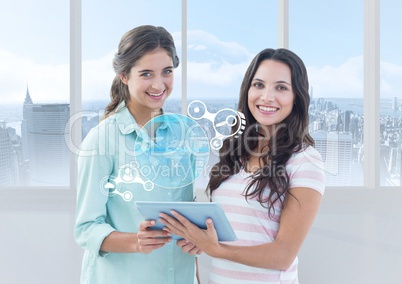 Woman holding digital tablet with interface design against cityscape in background