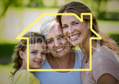 Mother, daughter and grandmother smiling together in the park with house outline