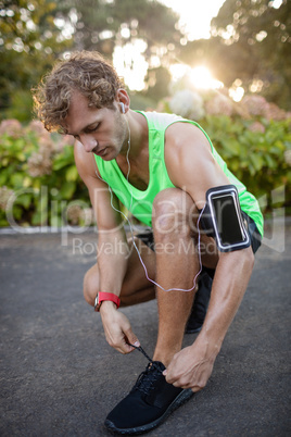 Man tying his shoe laces