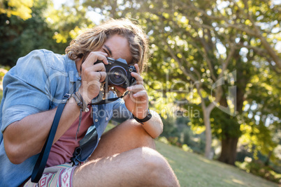 Man taking picture with digital camera