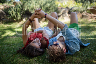 Couple holding hands in park