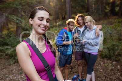 Smiling woman hiking with her friends