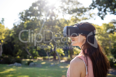 Woman using a VR headset in the park