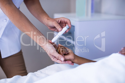 Female doctor checking patient sugar level