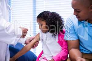 Doctor giving an injection to the patient