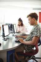 Students using computer in classroom