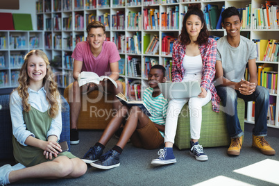 Portrait of happy students in library