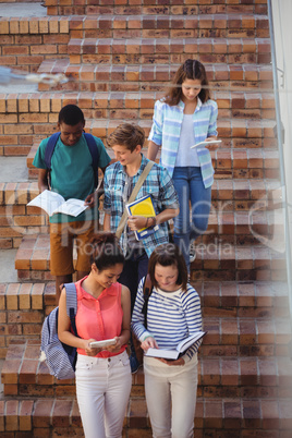 Students moving down staircase