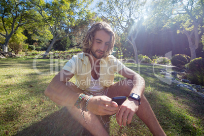 Happy man listening to music on mobile phone