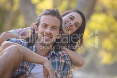 Young couple smiling in park