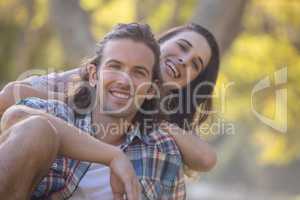 Young couple smiling in park