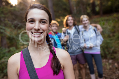 Portrait of smiling woman hiking with her friends