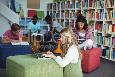 Attentive students studying in library