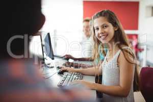 Student using computer in classroom