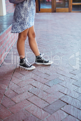 Schoolgirl standing in campus