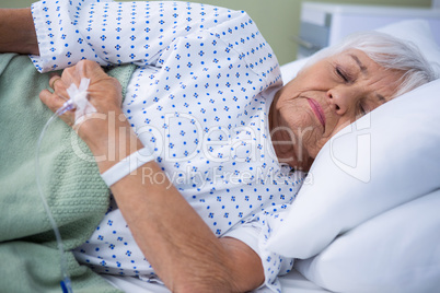 Senior patient lying on bed