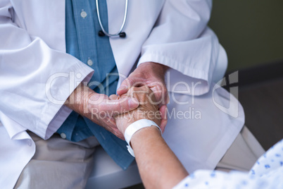 Doctor examining senior patient