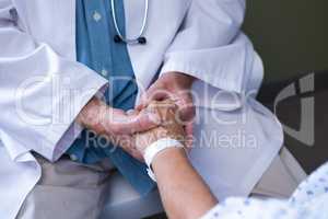 Doctor examining senior patient