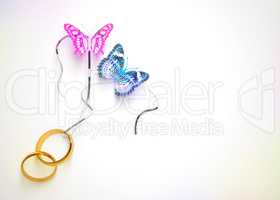 Two butterflies and two wedding rings