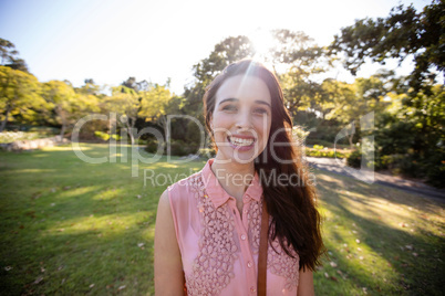 Portrait of beautiful woman smiling in the park