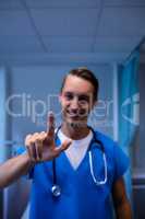 Portrait of doctor gesturing in ward