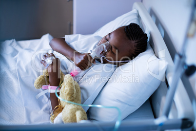 Patient wearing oxygen mask while sleeping