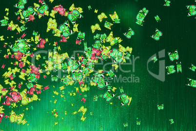 Multicolored butterflies on a dark green background