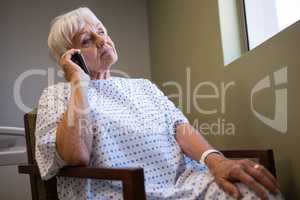 Senior patient talking on mobile phone