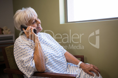 Senior patient talking on mobile phone