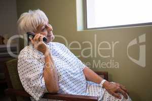 Senior patient talking on mobile phone