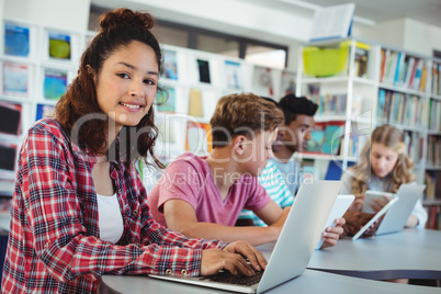 Students using laptop, digital tablet