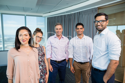 Portrait of smiling business colleagues standing together