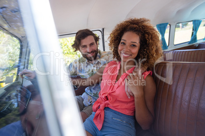 Couple sitting in campervan