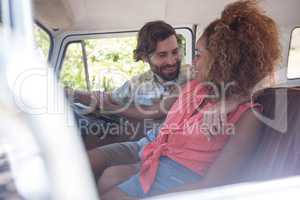 Couple interacting with each other in campervan