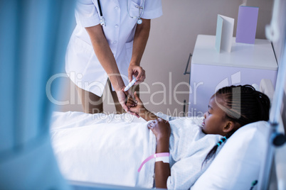 Female doctor checking patient sugar level