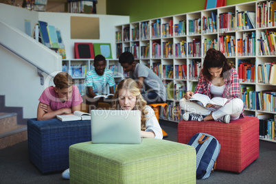 Attentive students studying in library