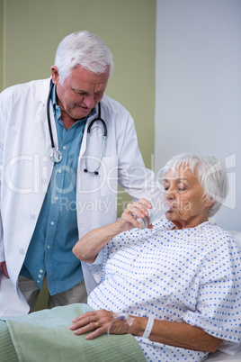 Senior patient drinking a glass of water