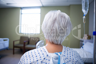 Rear-view of senior patient sitting in ward
