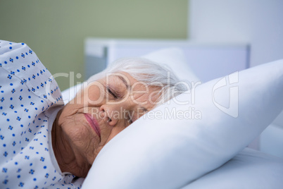 Senior patient lying on bed