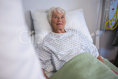 Senior patient lying on bed