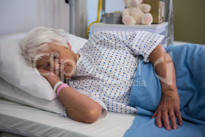 Senior patient lying on bed