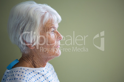 Senior patient standing in hospital