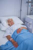 Senior patient lying on bed