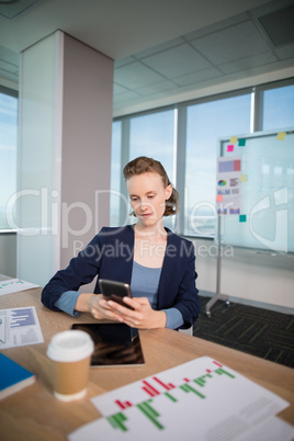 business executive using her mobile phone
