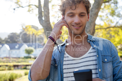 Man listening to music in park