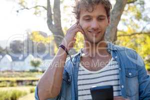 Man listening to music in park
