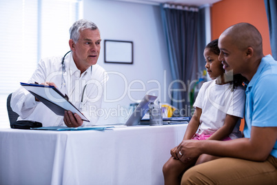 Doctor discussing report with patient