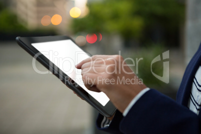 Business executive using digital tablet