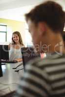 Students using computer in classroom